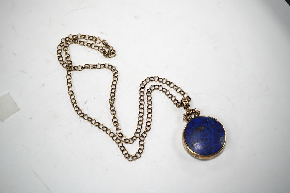 A modern 9ct gold mounted hardstone set circular pendant, 32mm, on a 9ct chain, 60cm, gross weight 38.7 grams. Condition - fair